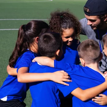 high-angle-trainer-talking-players